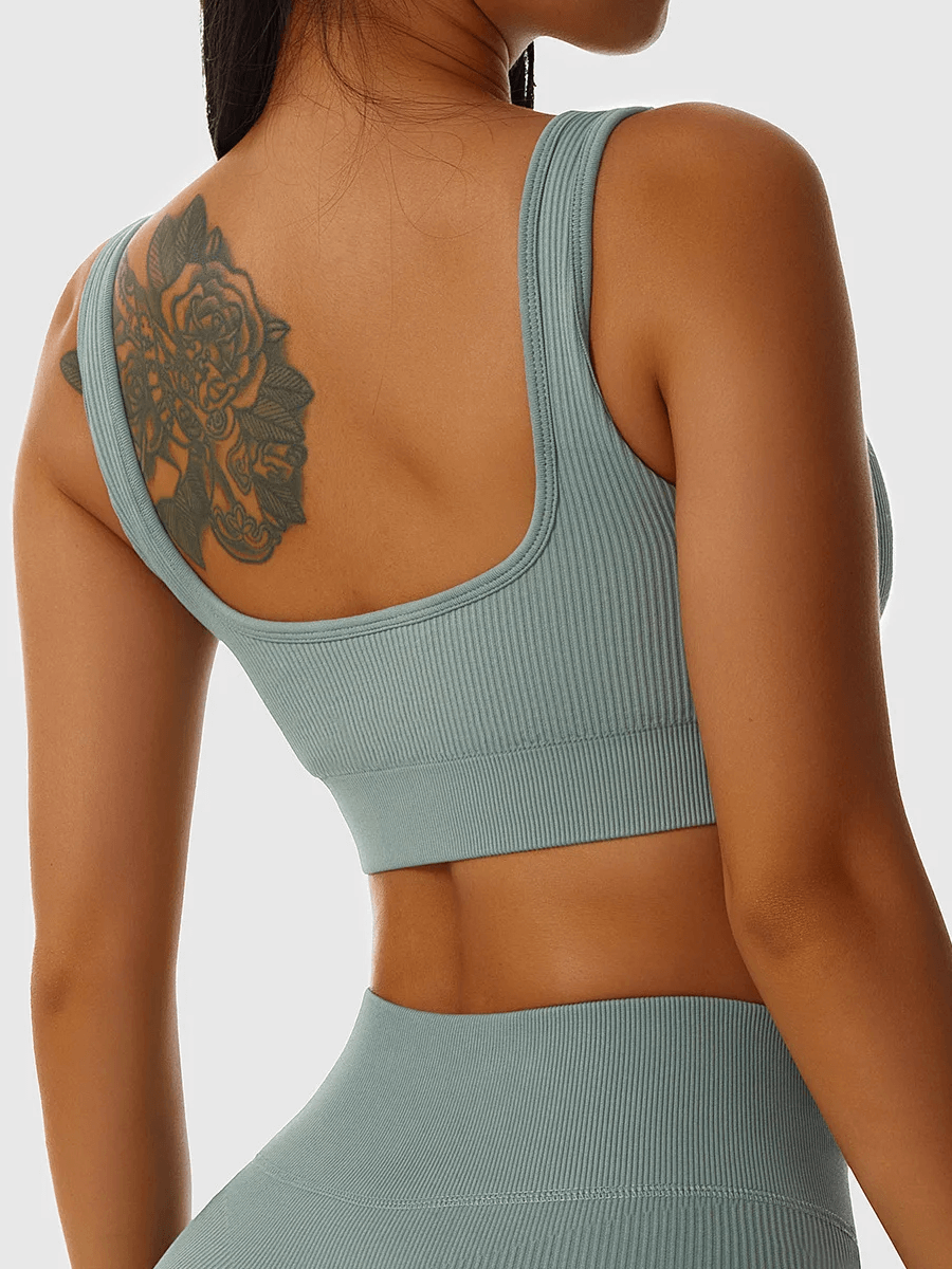 Seamless ribbed sports bra in teal showing a supportive fit with stylish ribbed design, perfect for yoga, pilates, and workouts.
